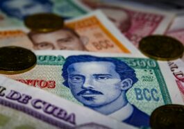 20 banknote on white and blue textile